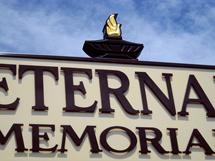 Carved PVC "ETERNAL LAMP" atop of a dimensional sign, by Gary The Local Brush