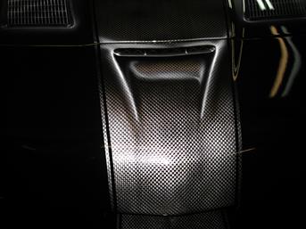 Carbon Fiber Racing Stripe is PAINTED on the hood of a Corvette