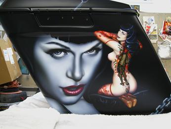 Portrait & Nude of Bettie Page Airbrushed onto a custom Harley saddle bag