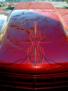 Hood Pinstriping on a Candy Red Pickup Truck